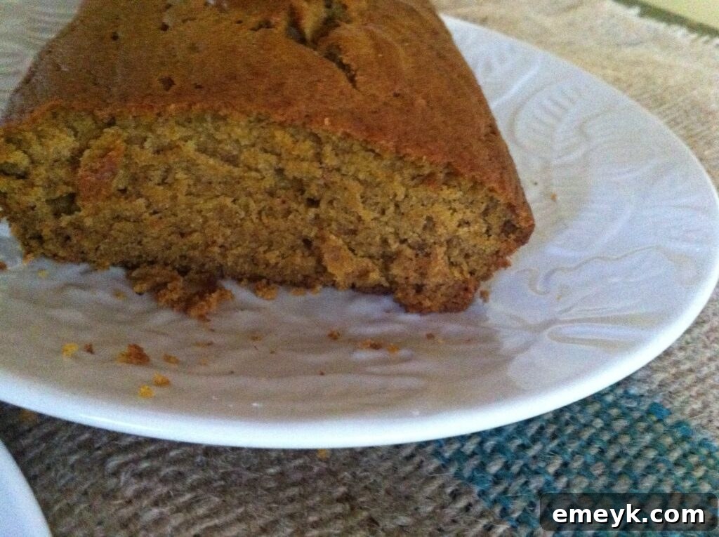 Sliced pumpkin bread revealing its moist and tender crumb