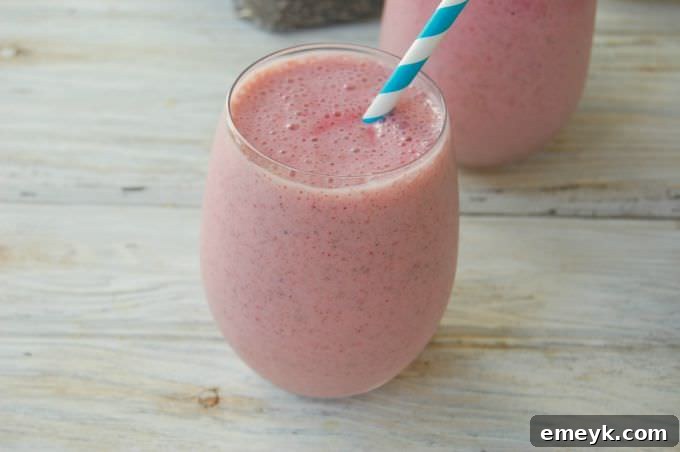 Refreshing Strawberry Banana Chia Smoothie in a glass with a straw, ready to drink.