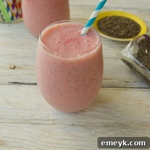 Strawberry Banana Chia Smoothie in a glass, ready to be served.