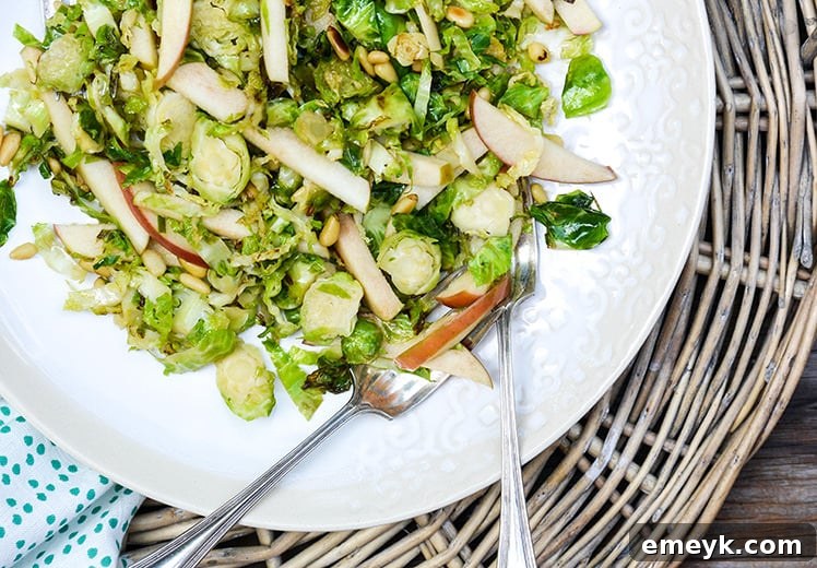 Crisp Shredded Brussels Sprouts and Apple Salad with a light dressing