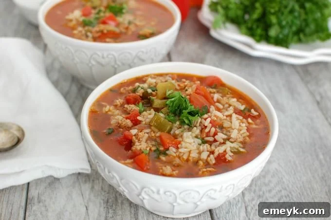 Close-up of Slow Cooker Stuffed Pepper Soup simmering in a slow cooker, showcasing the rich colors and textures.