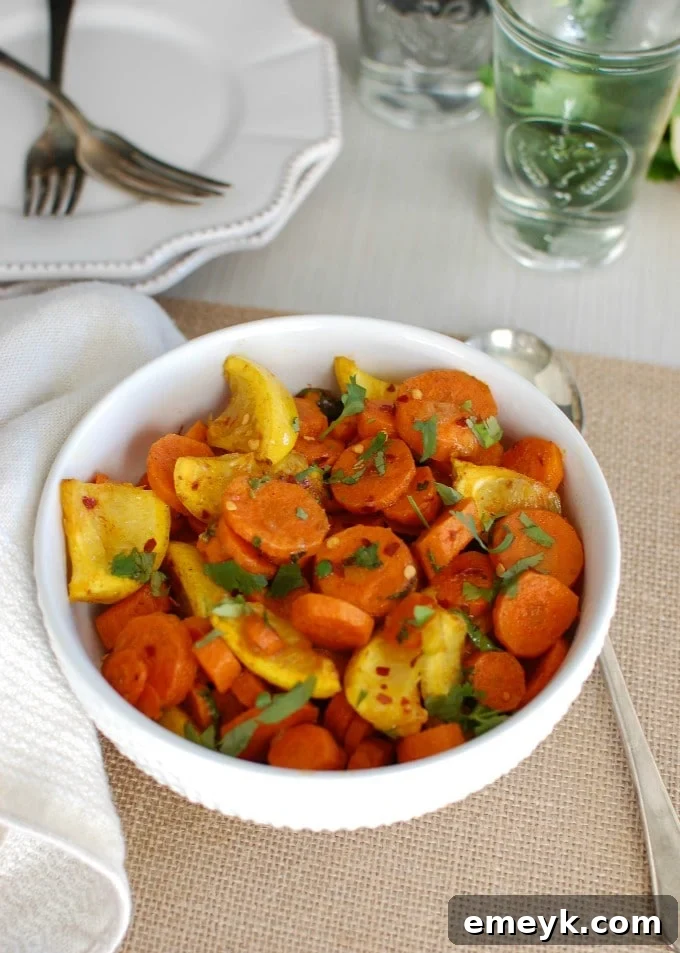 A serving of Moroccan Roasted Carrots in a bowl, ready to eat, with fresh cilantro garnish