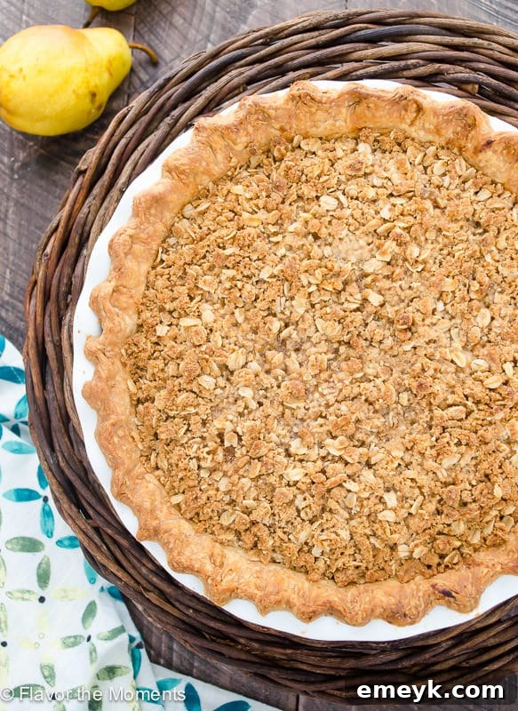 Irresistible Thanksgiving Treats 12 A rustic pear ginger crumble pie, baked in a pie dish with a golden crumble topping.