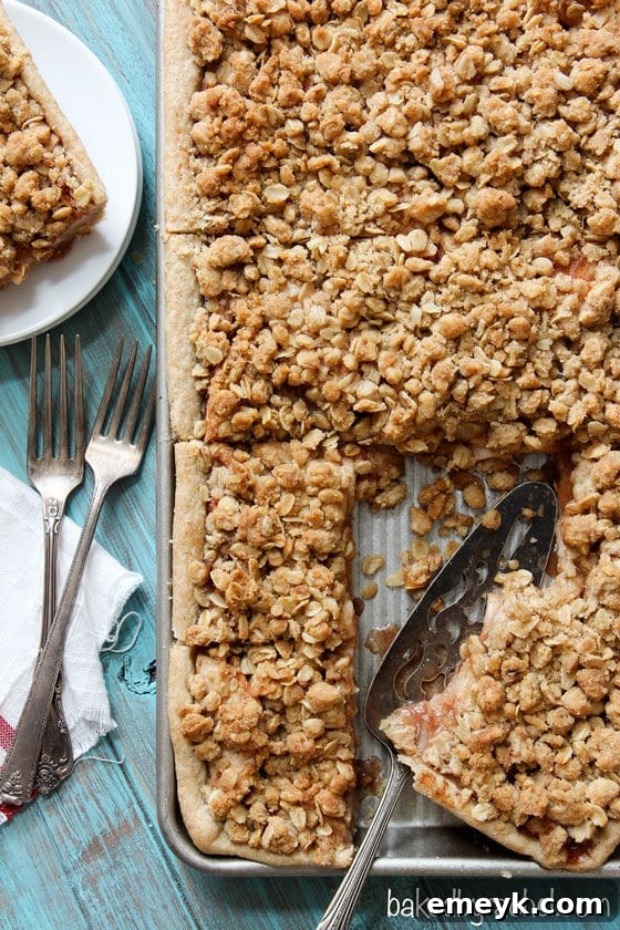 Irresistible Thanksgiving Treats 9 A large rectangular apple crumb slab pie, with a golden lattice top revealing sweet apple filling.