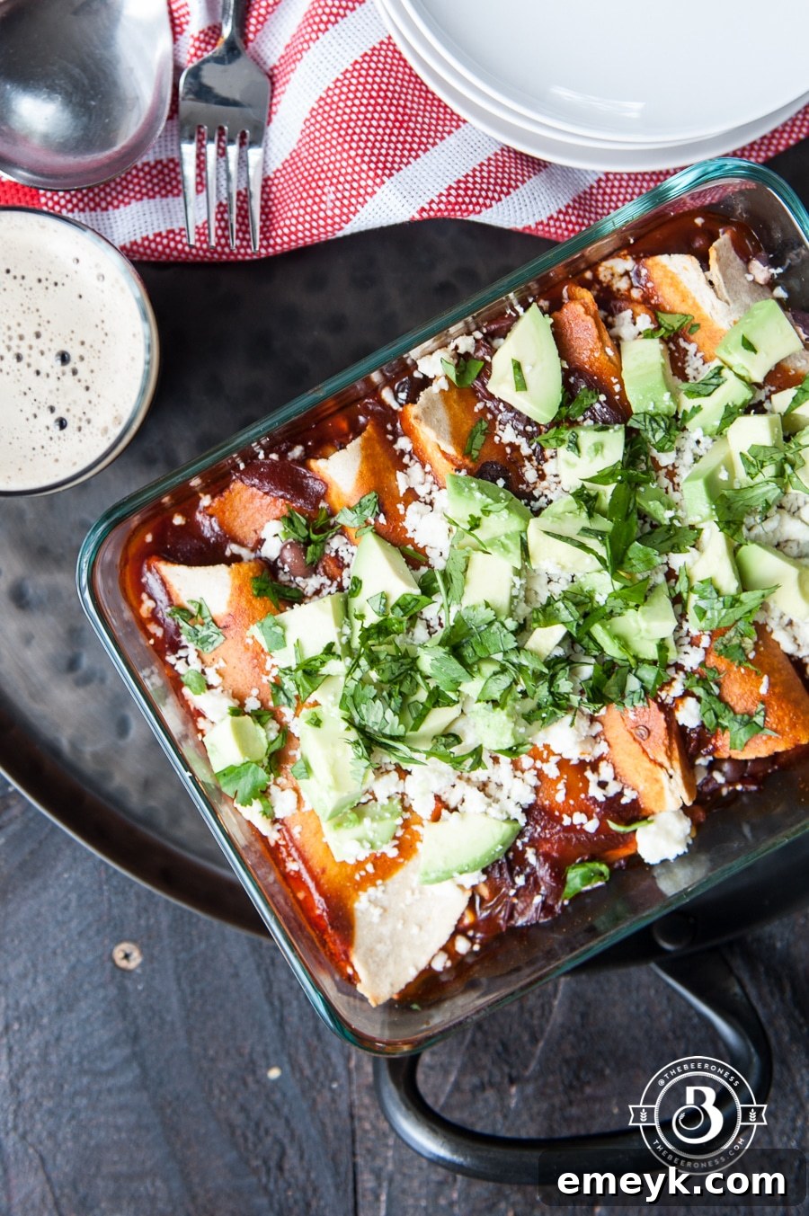 Flavorful Corn and Black Bean Enchiladas topped with rich red sauce