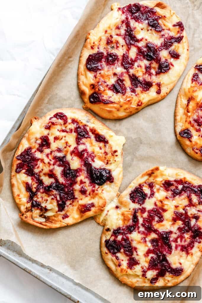 Warm Brie Cranberry Naan Bread, freshly baked, with melted brie and cranberry sauce