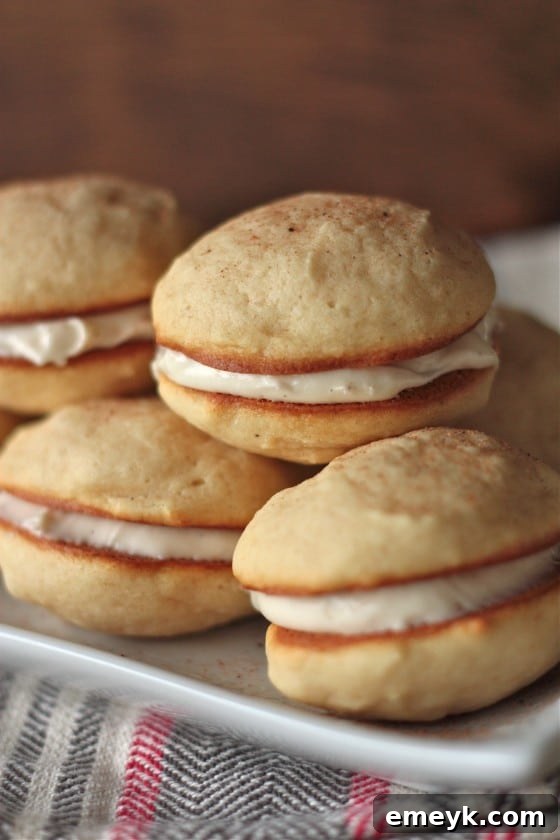 Decadent Eggnog Whoopie Pies, a festive sandwich cookie featuring rich eggnog flavor.