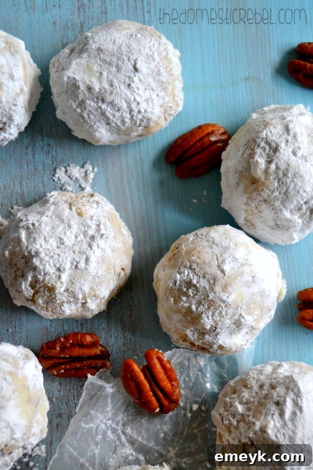 Classic Snowball Cookies, also known as Russian Tea Cakes or Mexican Wedding Cookies, dusted with powdered sugar.