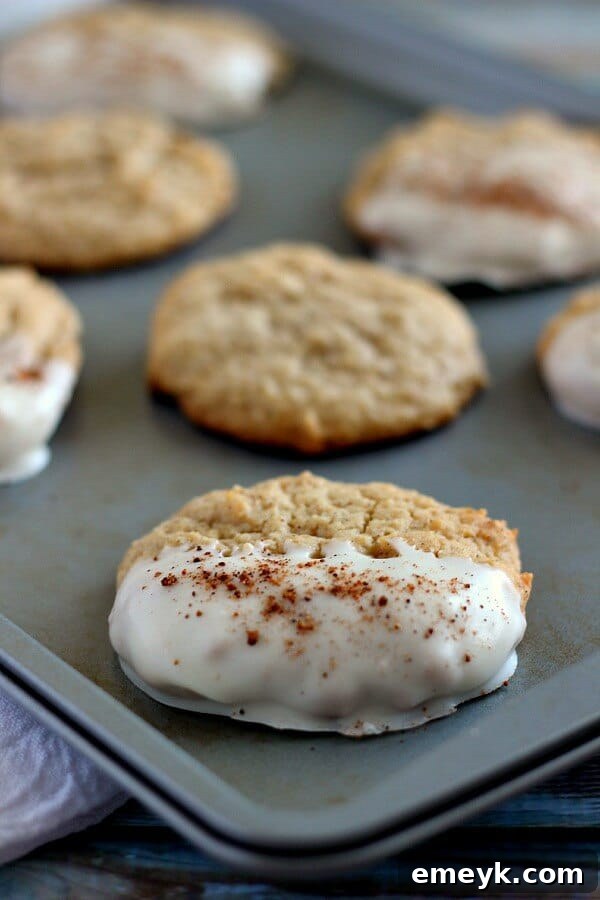 Sweet White Chocolate Dipped Eggnog Cookies, a festive treat combining rich flavors.