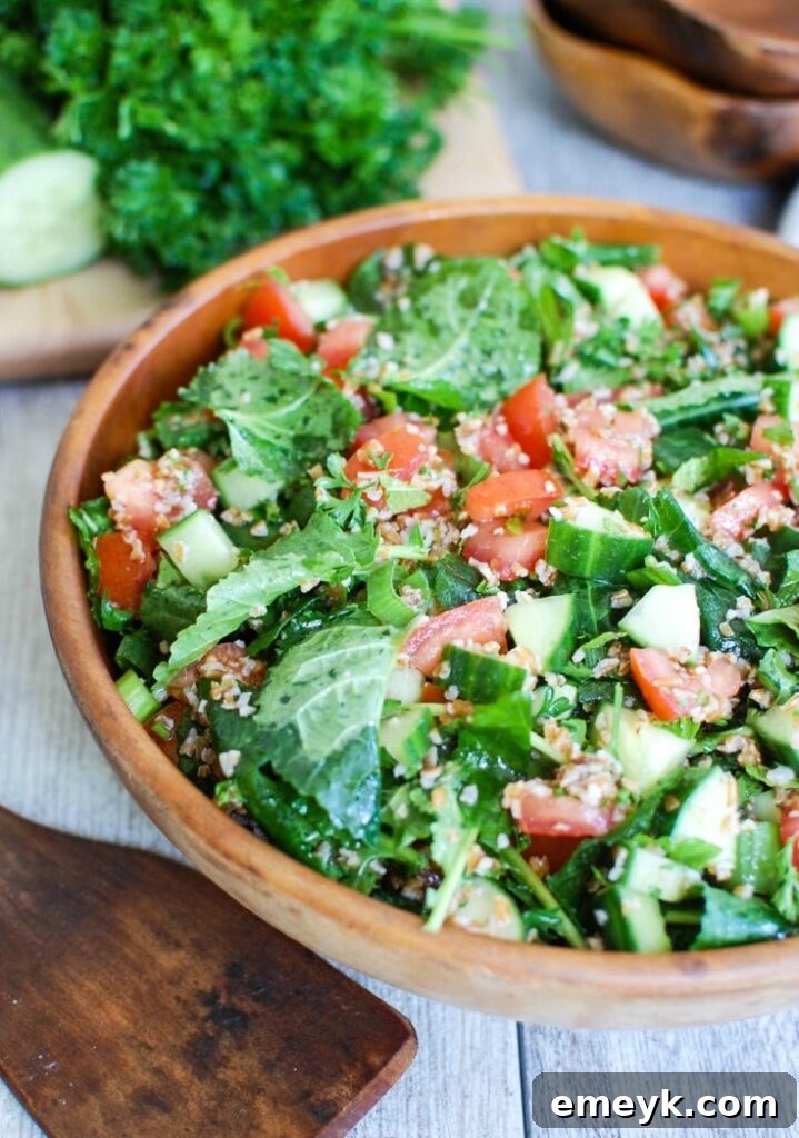 Kale Cucumber Tabbouleh with wooden spoon