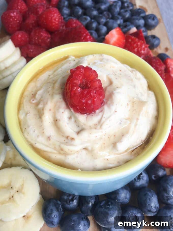 Quick and Healthy Fruit Yogurt Dip made with Greek yogurt, peanut butter, and honey for snacking