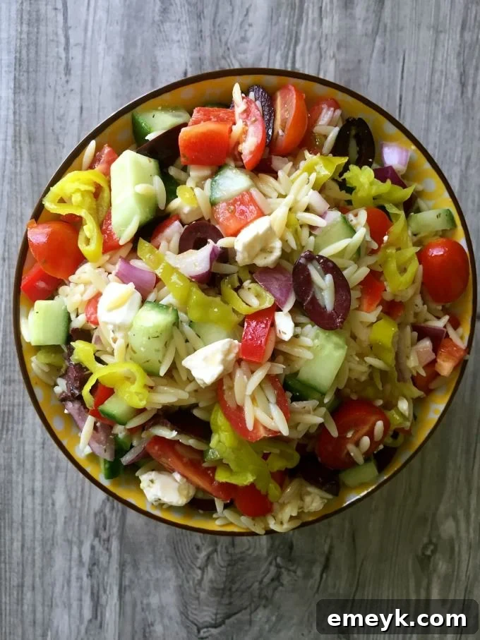 Refreshing Greek Orzo Pasta Salad, a flavorful dish ideal for summer gatherings, picnics, and BBQs