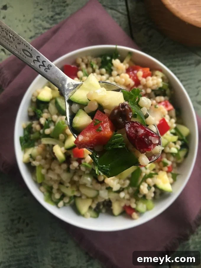 My 15 Standout Recipes from 2015 13 A vibrant Israeli Couscous Salad with colorful fresh vegetables like cucumber, tomatoes, and bell peppers, dressed with a lemon vinaigrette.