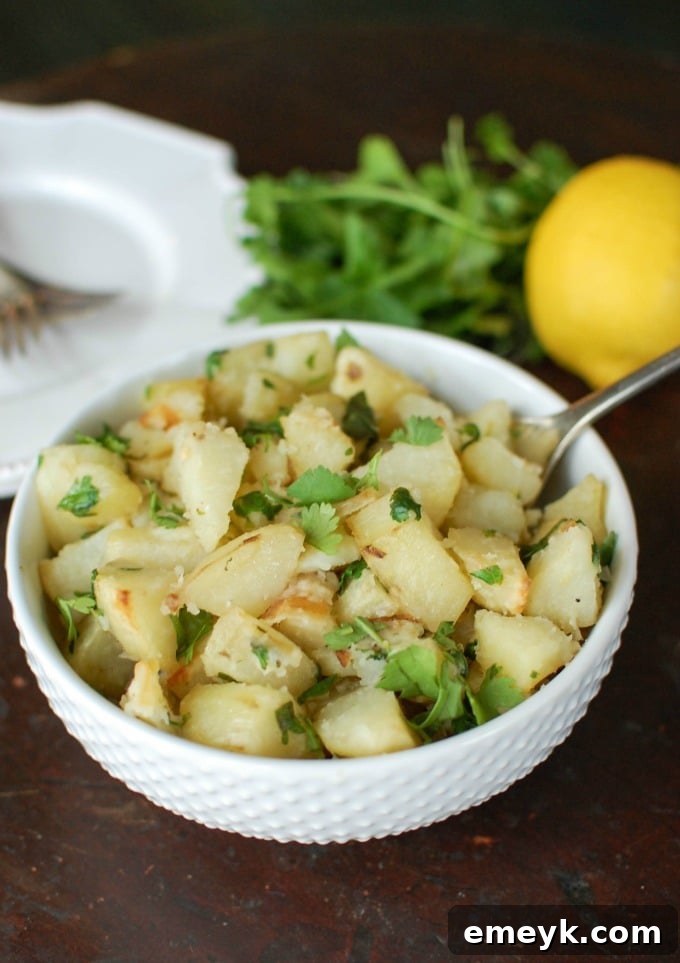 My 15 Standout Recipes from 2015 3 Golden brown Lemon Cilantro Roasted Potatoes in a serving bowl, garnished with fresh cilantro.