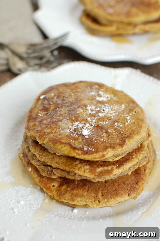 My 15 Standout Recipes from 2015 7 A stack of fluffy Pumpkin Pie Pancakes drizzled with syrup and sprinkled with pecans.