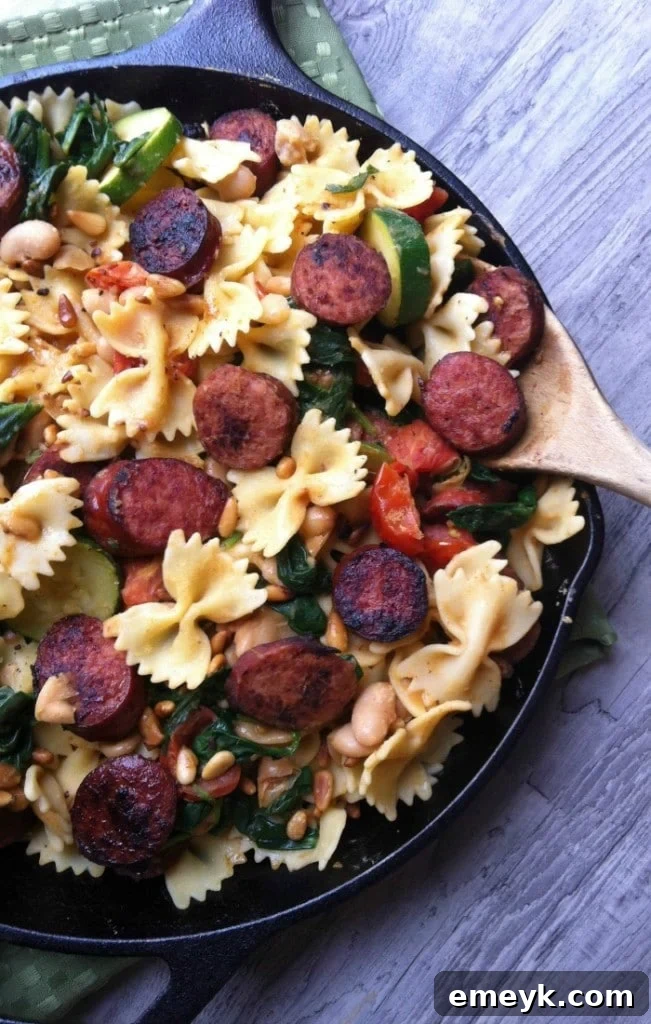 Hearty Smoked Sausage, White Bean and Spinach Pasta with Toasted Pine Nuts, a quick and comforting dish perfect for family dinners.