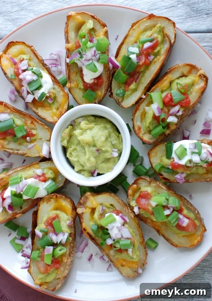 Zesty Guacamole-Filled Potato Shells 4 Guacamole Stuffed Potato Skins on white platter