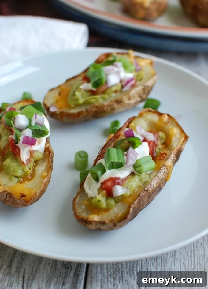 Zesty Guacamole-Filled Potato Shells 5 Guacamole Stuffed Potato Skins on a plate