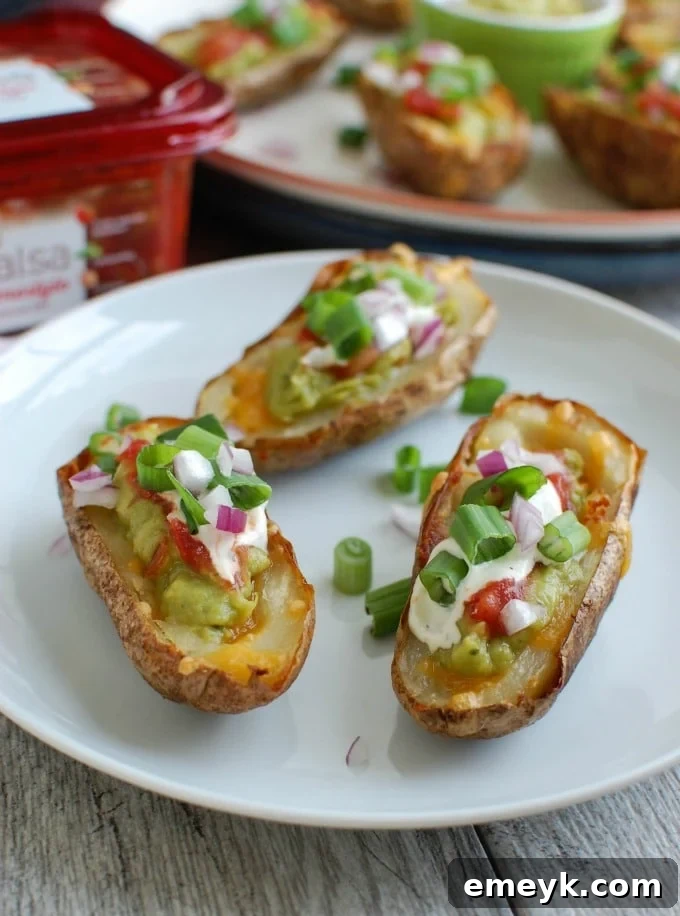 Zesty Guacamole-Filled Potato Shells 7 Guacamole Stuffed Potato Skins three on a plate