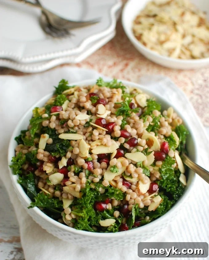 Vibrant and healthy Kale Couscous Pomegranate Salad with fresh ingredients