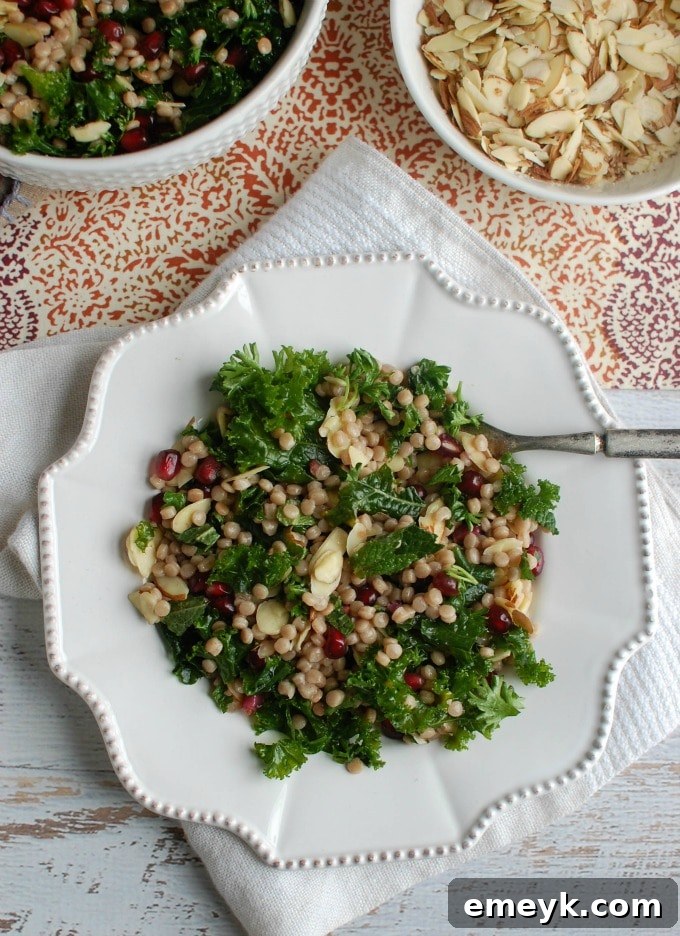 A beautifully presented Kale Couscous Pomegranate Salad, packed with flavor