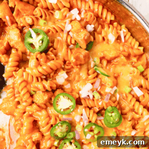 One Pot Chicken Enchilada Pasta, a close-up image of the dish ready to serve.