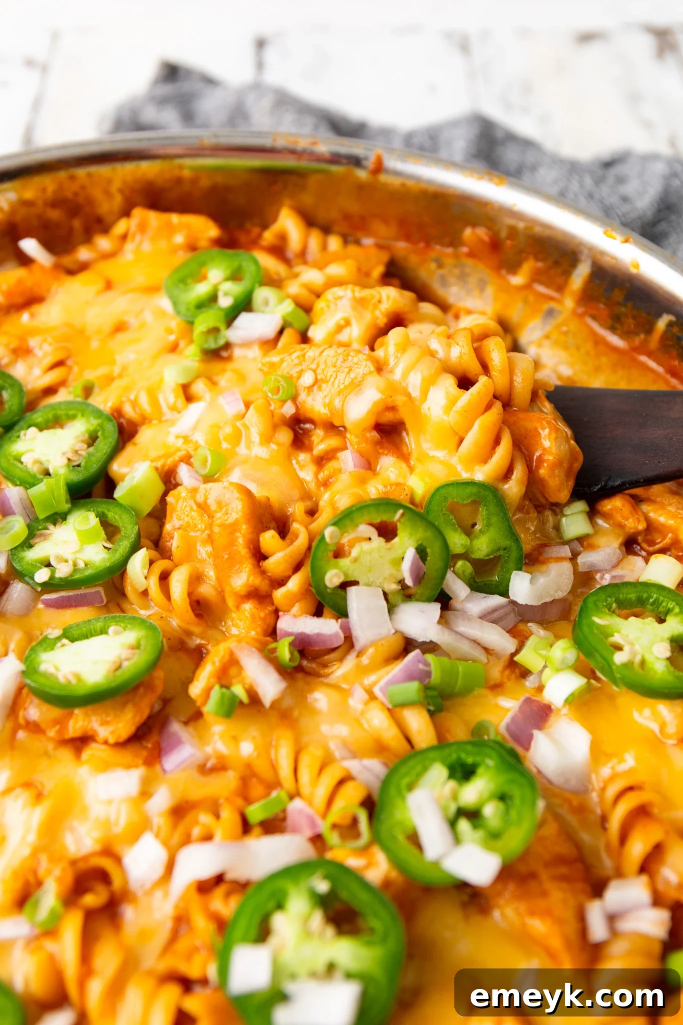 A large pot filled with One Pot Chicken Enchilada Pasta, showing a full and hearty portion.