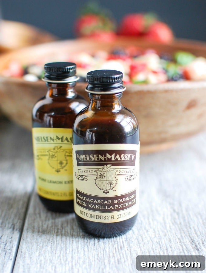 Nielsen-Massey Pure Vanilla and Lemon Extracts alongside the Mixed Berry Caprese Orzo Salad ingredients