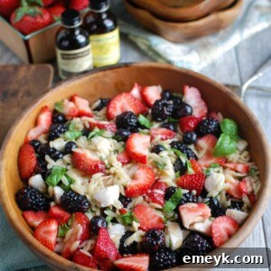 A serving of Mixed Berry Caprese Orzo Salad, ready to be enjoyed