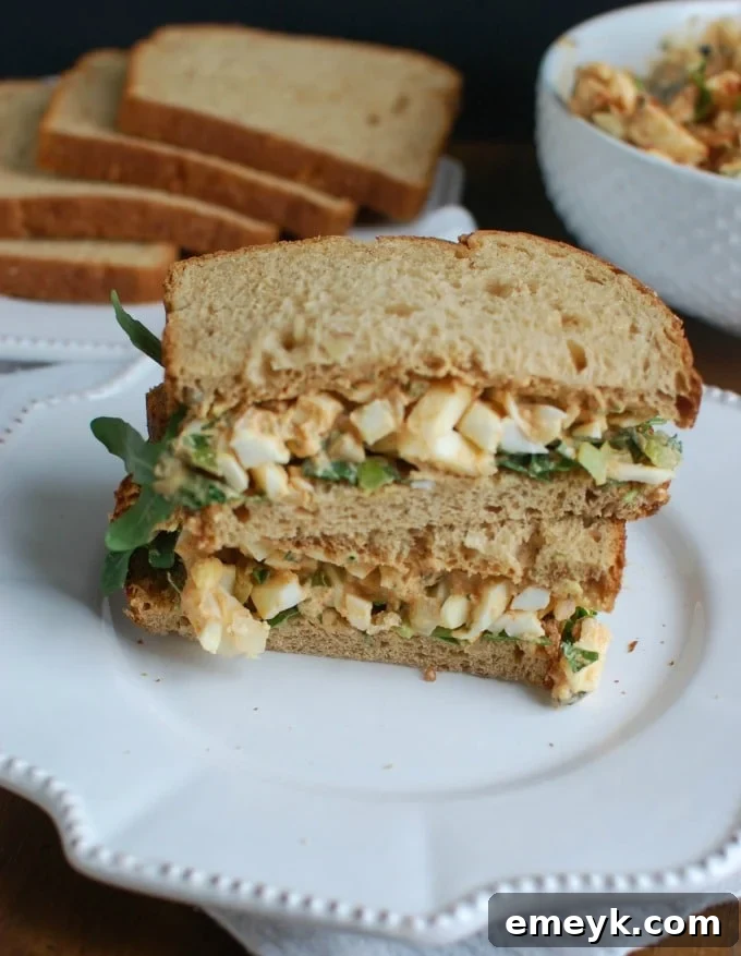 Sweet Southern-Style Egg Salad served on a bed of crisp lettuce with a side of crackers.