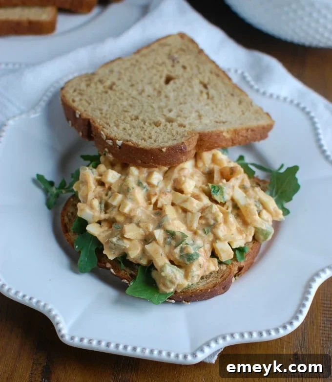 Sweet Southern-Style Egg Salad served sandwich-style on toasted bread with a sprinkle of paprika.