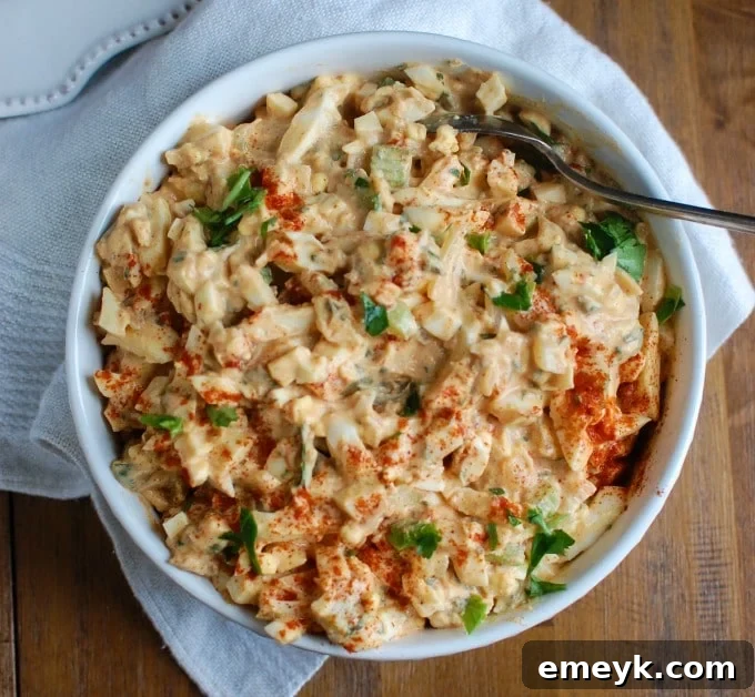 Close-up shot of Sweet Southern-Style Egg Salad in a bowl, showing its creamy texture and visible relish.