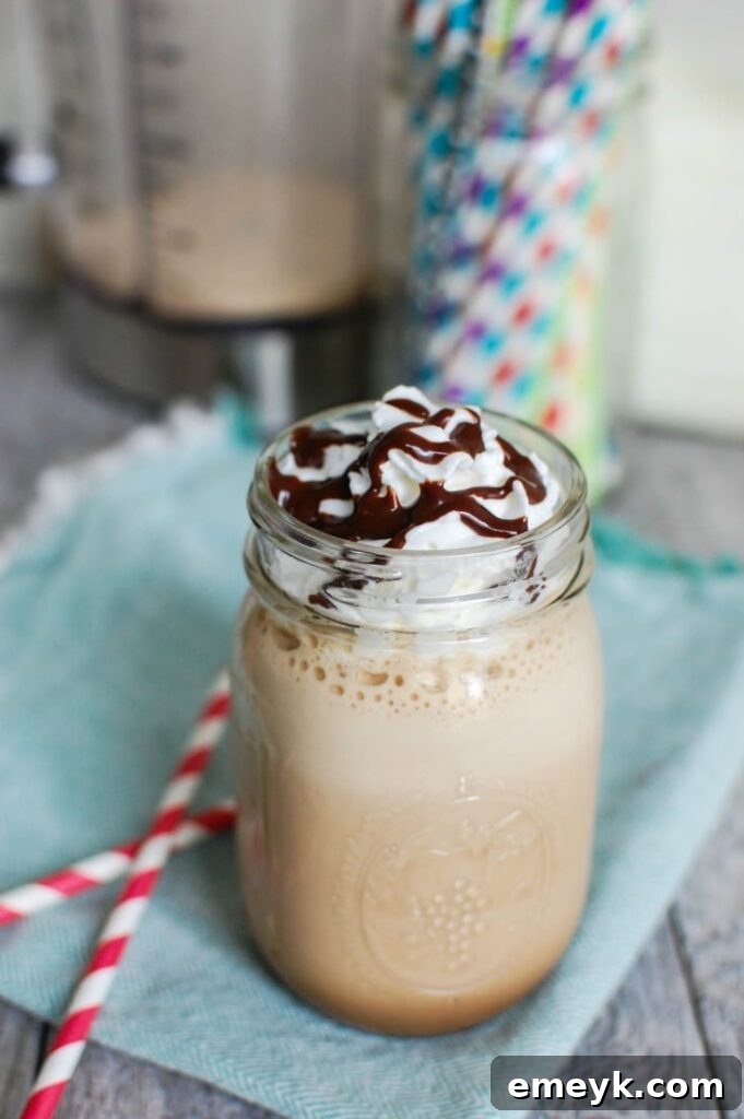 Homemade Mocha Frappuccino topped with whipped cream and chocolate sauce