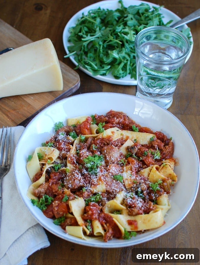 Close-up of the simmering Slow Cooker Turkey Sausage Bolognese sauce, showcasing its rich texture and color