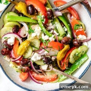 Beautifully composed Greek Village Salad, Horiatiki, in a rustic bowl.