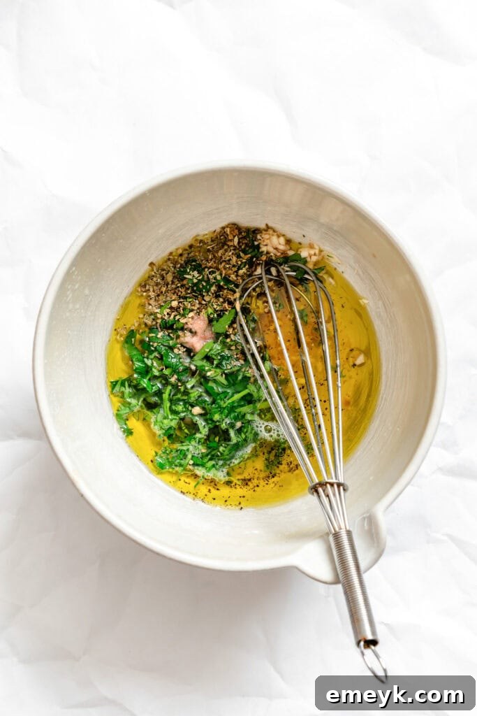 Ingredients for Greek Village Salad dressing in a bowl, ready to be mixed.