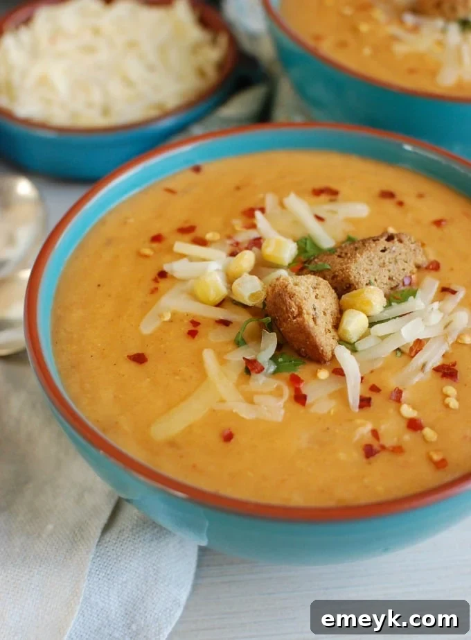 Cozy Cheesy Slow Cooker Potato Corn Chowder 2 Delicious and comforting Slow Cooker Cheesy Potato Corn Chowder, a perfect vegetarian comfort food meal