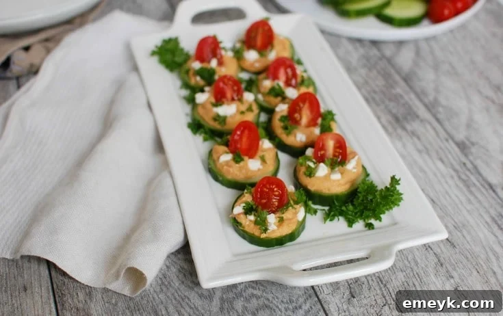 Crisp Cucumber Hummus Medallions 3 Close-up of Cucumber Hummus Bites presented with a rustic napkin, highlighting their inviting freshness.