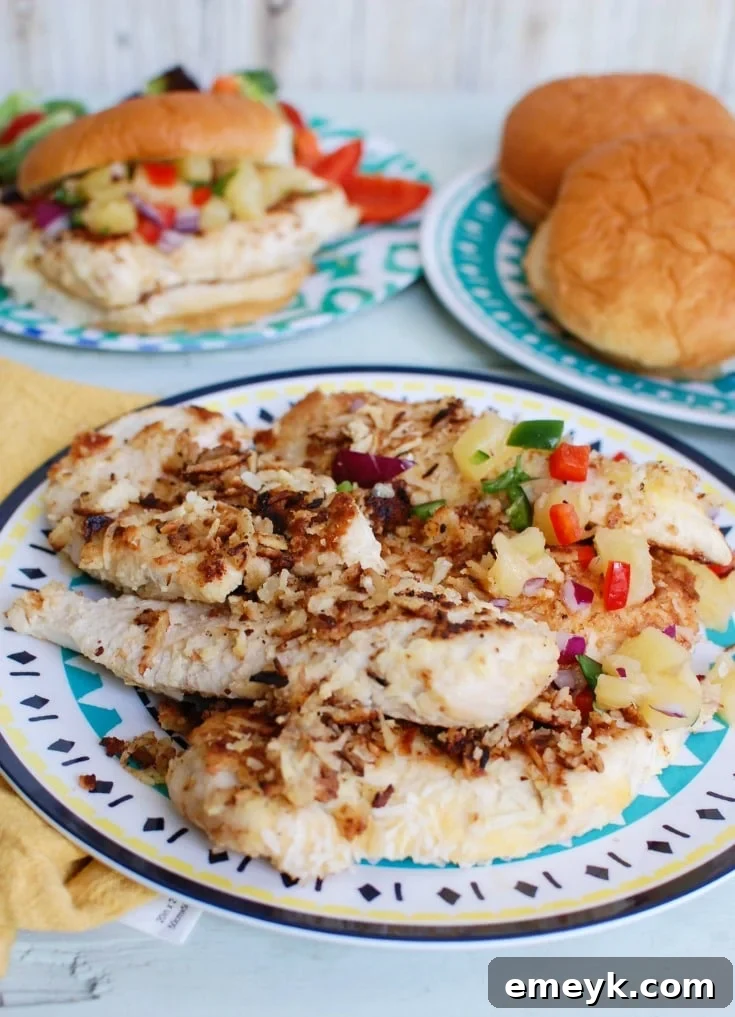 Crispy Macadamia Coconut Chicken with Tropical Pineapple Salsa 2 Macadamia Coconut Crusted Chicken with Pineapple Salsa makes a perfect fresh, summer meal. Tropical flavors pair nicely with the chicken for a delightful dish.
