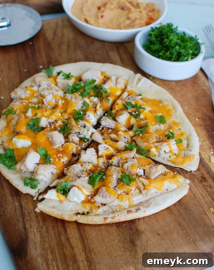 4-Chicken-Feta-Cheddar-Pita-Pizta-3-1-of-1, a quick and customizable pizza option.