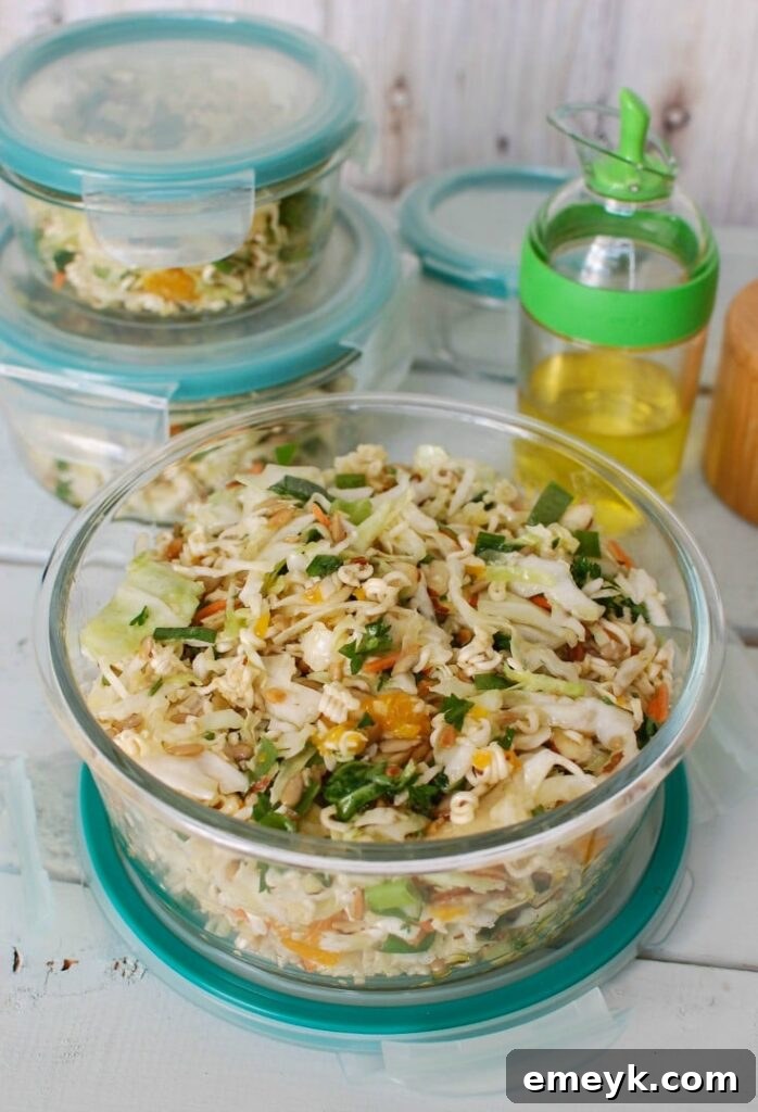 A large serving bowl filled with healthy and easy Asian Ramen Noodle Salad, ideal for any picnic or BBQ gathering.
