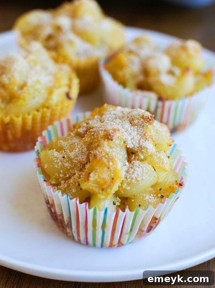 Golden brown Mac and Cheese Muffins served on a white plate with fresh parsley