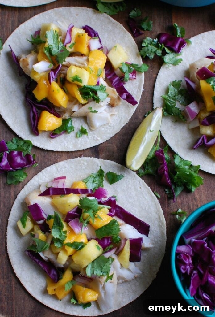 Arrangement of Grilled Fish Tacos with Tropical Salsa, accented with fresh lime slices