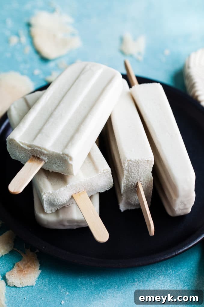 Aromatic Coconut Lemongrass Ginger Popsicle, a fusion of refreshing and warming exotic flavors.