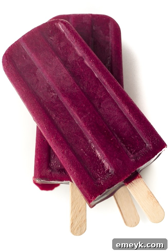 Sweet and tart Cherry Lemonade Popsicles, a classic summer flavor combination in frozen form.