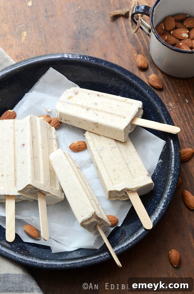 Gourmet Cinnamon Toasted Almond Dulce de Leche Cheesecake Pops, a decadent and unique frozen dessert.