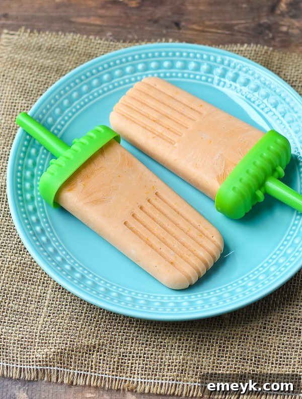 Healthy Orange Creamsicle Popsicle, a nostalgic and guilt-free summer treat reimagined.