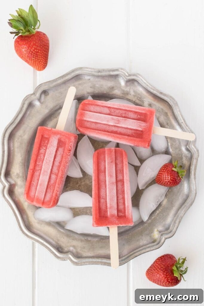 Classic Strawberry Popsicles made with fresh, ripe strawberries, a simple and sweet summer treat.