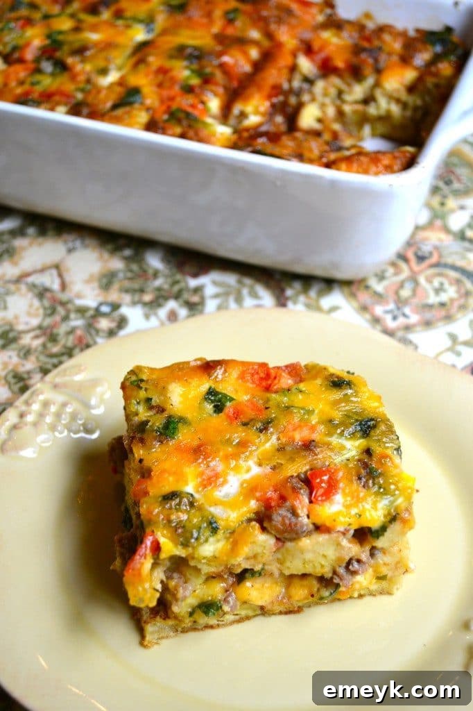 29 Brilliant Breakfasts for Effortless Mornings 15 Hearty Egg and Sausage Breakfast Casserole with Spinach and Tomatoes from Stuck on Sweet, perfect for family meal prep.
