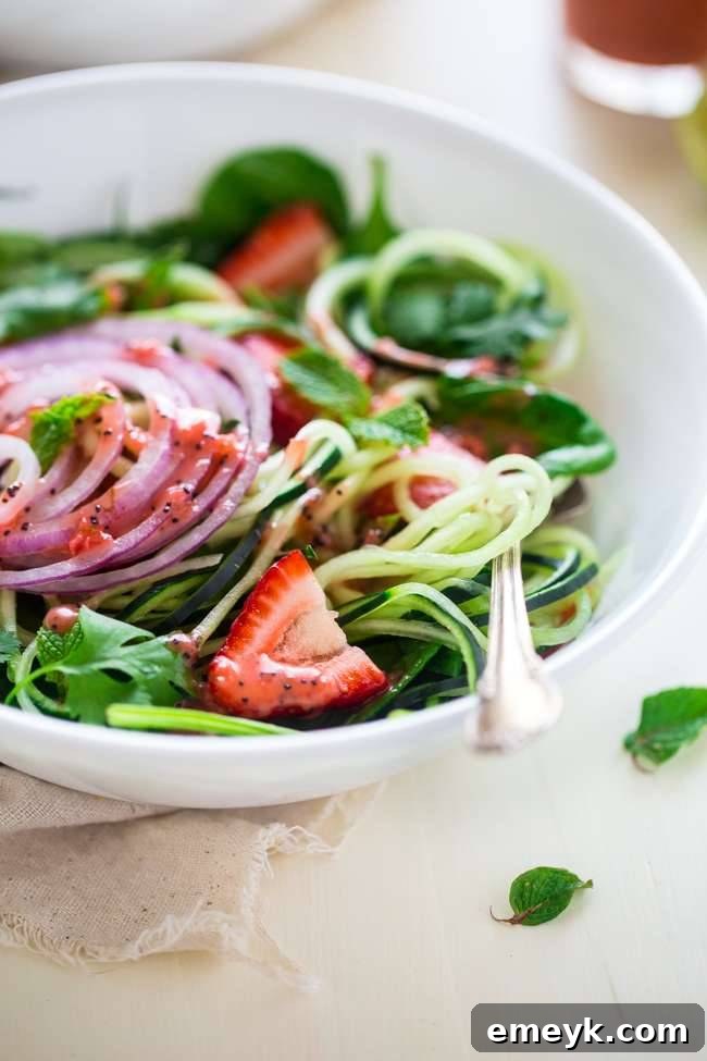 Refreshing Spiralized Cucumber Salad with Chia Seed and Strawberry Vinaigrette, a vegan and paleo option